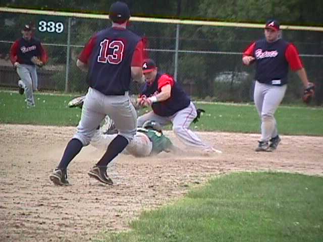Brock Robinson tags a runner out